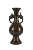 A Chinese large Inscribed bronze dragon-handled vase