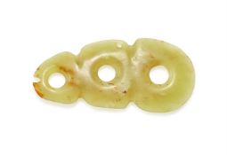 A Chinese yellowish celadon jade three-hole plaque