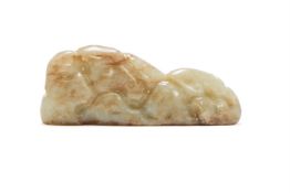 A Chinese carved celadon jade brush rest