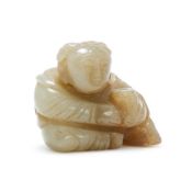 A Chinese celadon jade carving of a boy