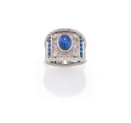 A STAR SAPPHIRE AND GEM SET DRESS RING