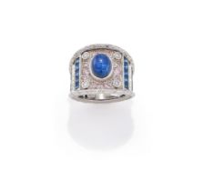 A STAR SAPPHIRE AND GEM SET DRESS RING