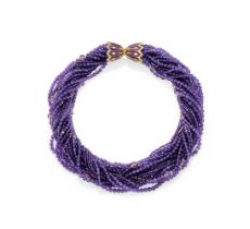 ATTRIBUTED TO SCHLUMBERGER, AN AMETHYST AND ENAMEL TORSADE NECKLACE