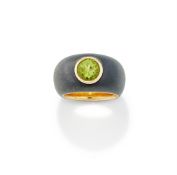 A PERIDOT AND IRON DRESS RING