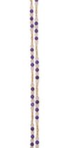 AN AMETHYST AND ROCK CRYSTAL LONG CHAIN
