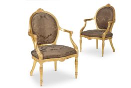 ‡ A PAIR OF GEORGE III GILTWOOD ARMCHAIRS, CIRCA 1780