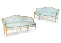 ‡ A PAIR OF GEORGE III GILTWOOD SETTEES, CIRCA 1785