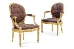 ‡ A PAIR OF GEORGE III GILTWOOD ARMCHAIRS, ATTRIBUTED TO JOHN LINNELL