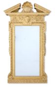 ‡ A GEORGE II CARVED GILTWOOD MIRROR, CIRCA 1740