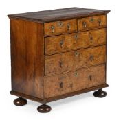A WALNUT AND CROSS BANDED CHEST OF DRAWERS, CIRCA 1720 AND LATER
