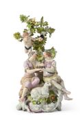A VIENNA GROUP OF A SEATED SHEPHERD AND SHEPHERDESS, CIRCA 1765
