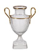A CONTINENTAL PRESS-MOULDED GLASS AND GILT-METAL MOUNTED TWO-HANDLED URN, MODERN