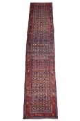 A PERSIAN FARAHAN RUNNER OR GALLERY CARPET