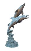 A LARGE BRONZE AND BRONZED FOUNTAIN MODELLED AS TWO LEAPING DOLPHINS, MODERN
