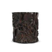 A Chinese carved hardwood 'Three Friends of Winter' brush pot