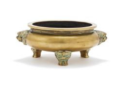 A Chinese bronze twin handled tripod censer