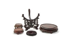 Four Chinese carved circular wood stands
