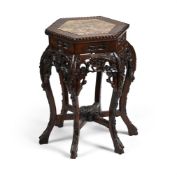 A Chinese hardwood and marble topped hexagonal jardinière stand