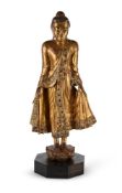 A Burmese gilded and lacquered wood figure of Buddha