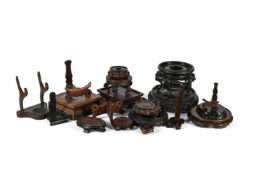 A group of nineteen various wood stands
