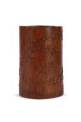 A Chinese bamboo brushpot with prunus and a poem
