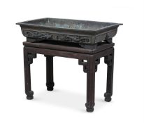 A large Chinese bronze 'dragon' jardinière