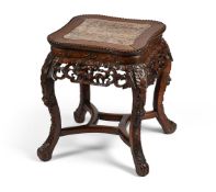 A Chinese hardwood and marble topped jardinière stand