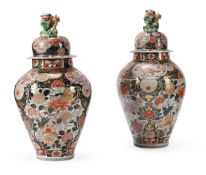 A large pair of Japanese Arita vases and covers