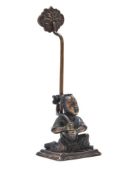 A Chinese bronze 'Boy' candle holder