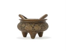 A Chinese bronze two-handled tripod censer