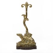 A POLISHED BRASS DOG BASE DOOR PORTER OR DOOR STOP, MID 19TH CENTURY