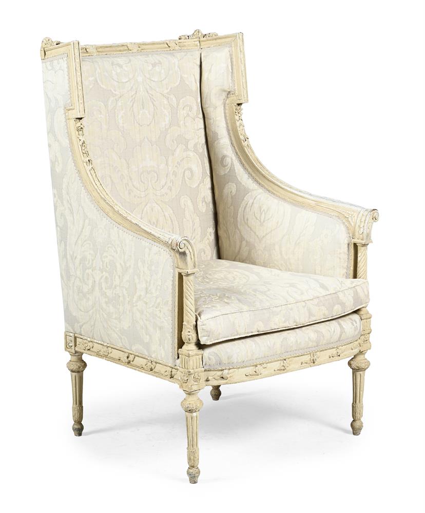 A FRENCH CREAM PAINTED WING ARMCHAIR, LATE 19TH OR EARLY 20TH CENTURY