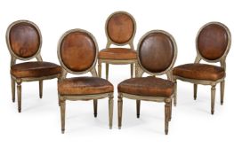 A SET OF FIVE LEATHER UPHOLSTERED SIDE CHAIRS, IN LOUIS XVI STYLE, LATE 19TH OR EARLY 20TH CENTURY