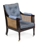 A GEORGE IV MAHOGANY LIBRARY BERGERE, CIRCA 1825
