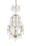A GLASS MOUNTED GILT BRASS SIX LIGHT CHANDELIER, IN THE 18TH CENTURY ITALIAN STYLE, 20TH CENTURY