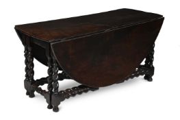 A CHARLES II OAK GATELEG DINING TABLE, CIRCA 1680