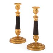 A PAIR OF PATINATED AND GILT BRONZE CANDLESTICKS, LATE 19TH OR EARLY 20TH CENTURY
