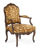 A LOUIS XVI CARVED BEECH AND UPHOLSTERED FAUTEUIL, LATE 18TH CENTURY