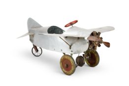 AN ALUMINIUM PEDAL CAR IN THE FORM OF AN AEROPLANE, SECOND QUARTER 20TH CENTURY