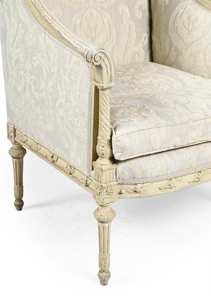 A FRENCH CREAM PAINTED WING ARMCHAIR, LATE 19TH OR EARLY 20TH CENTURY - Image 3 of 3
