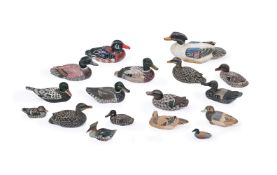 A COLLECTION OF APPROXIMATELY SEVENTEEN CARVED AND PAINTED WOOD MODELS OF DUCKS AND WATER FOWL