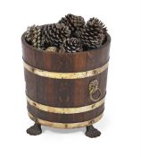 AN OAK LOG BIN OF COOPERED FORM, IN REGENCY STYLE, 20TH CENTURY
