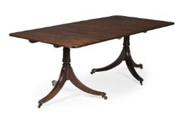 A MAHOGANY TWIN PEDESTAL EXTENDING DINING TABLE, IN GEORGE III STYLE, 19TH CENTURY