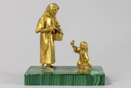 small antique presumably Russian sculpture in gilded bronze on a malachite base : "Woman with child"