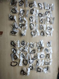 TIGERS EYE -BALL COTTON ADJUSTABLE BRACELETS - NEW IN ORIGINAL PACKAGING - JOBLOT OF 33