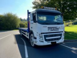 2009 VOLVO FM 300 FLATBED TRUCK – 6X2 TAG AXLE