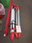 Two surveyor's laser level tripods and measuring staff