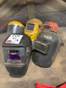Four various welding helmets