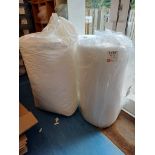 Quantity of various packaging materials including bubble wrap, Eco Flow loose fill chips, boxes,