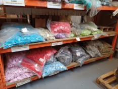 Contents of 2 x shelves containing Star balloon weights in various colours